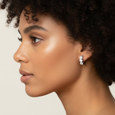 Lgd 3-Stone Huggie Earrings – Lab Diamond Earrings in 18K Gold | Just Brilliant – close-up view