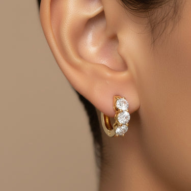 Lgd 3-Stone Huggie Earrings – Lab Diamond Earrings in 18K Gold | Just Brilliant – angle view