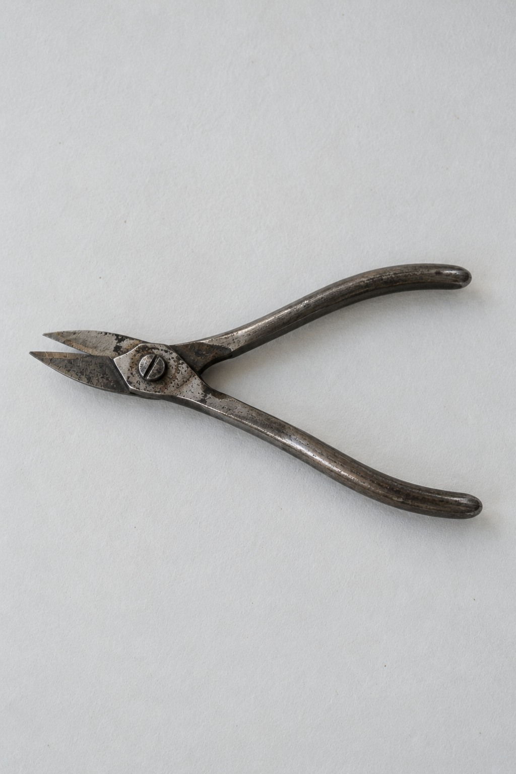 Original Just Brilliant craft study: steel goldsmith's snips with worn handles.