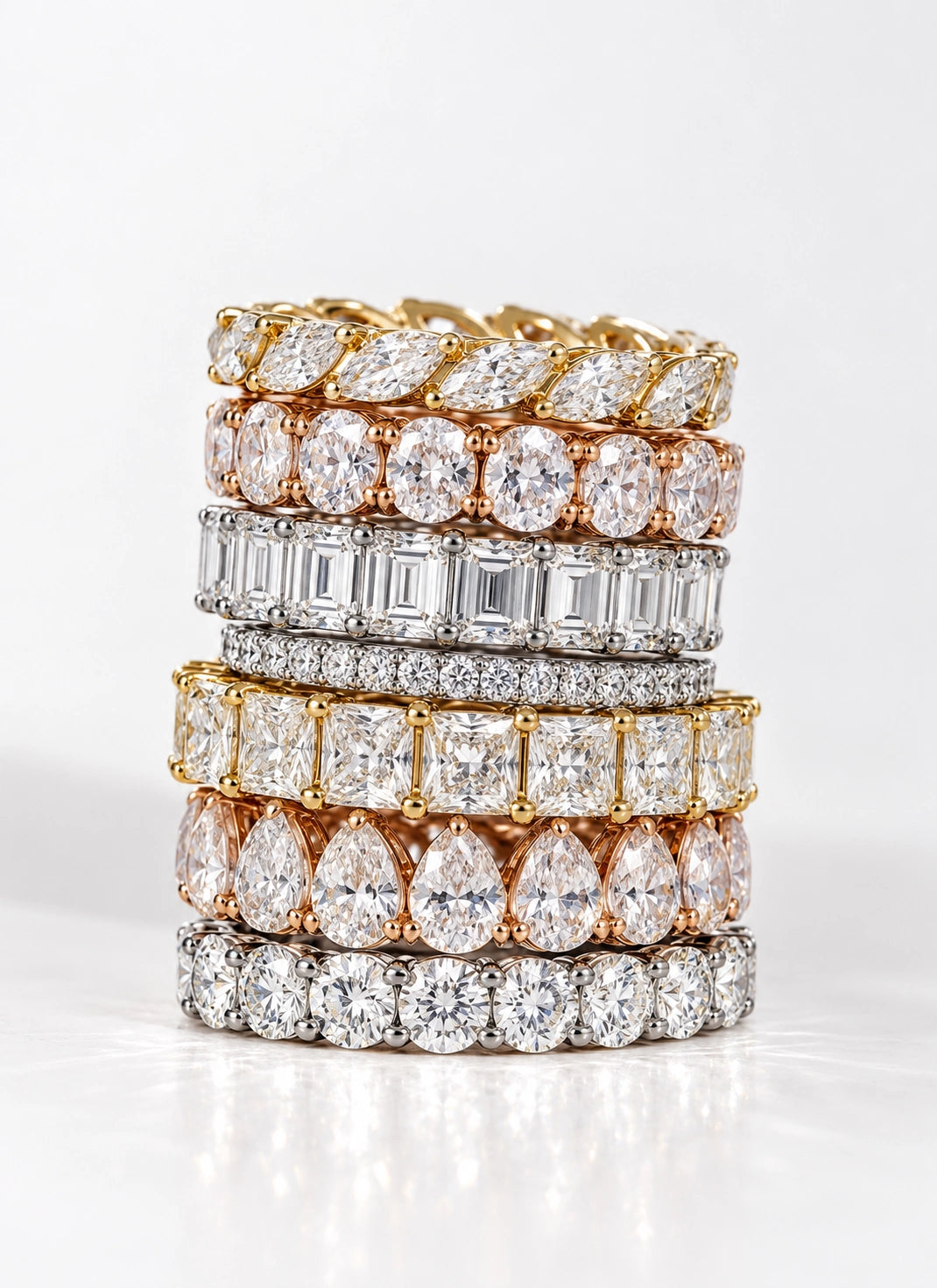 Diamond eternity bands in yellow, rose and white gold.