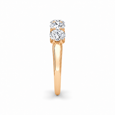 Just Brilliant Five Stone Diamond Band, Large version with Round Brilliant diamonds in 18K rose gold, side view. #jb-five-stone_large_round-brilliant_18k-rose-gold_side
