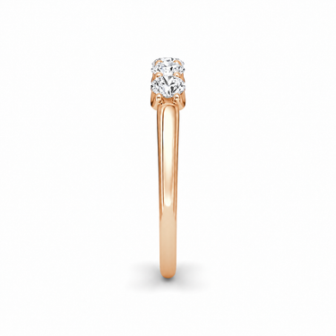 Just Brilliant Five Stone Diamond Band, Petite version with Round Brilliant diamonds in 18K rose gold, side view. #jb-five-stone_petite_round-brilliant_18k-rose-gold_side
