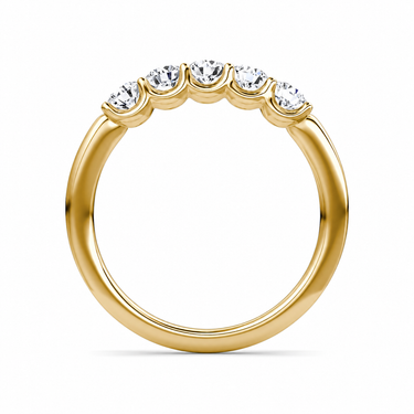 Just Brilliant Five Stone Diamond Band, Petite version with Round Brilliant diamonds in 18K yellow gold, profile view. #jb-five-stone_petite_round-brilliant_18k-yellow-gold_profile