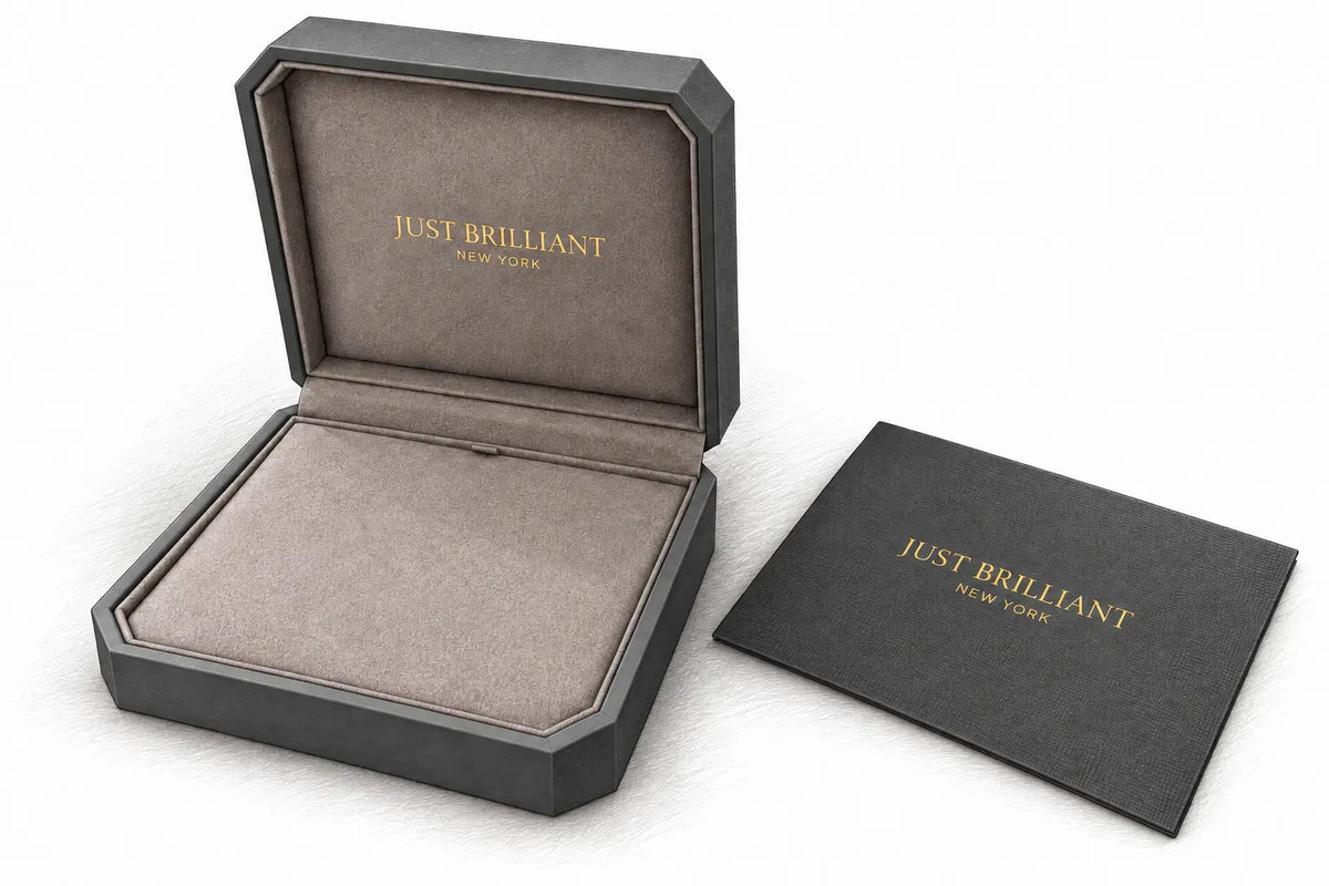 Pencil illustration of Just Brilliant’s open charcoal jewelry case with suede lining and gold lettering beside its certificate holder.